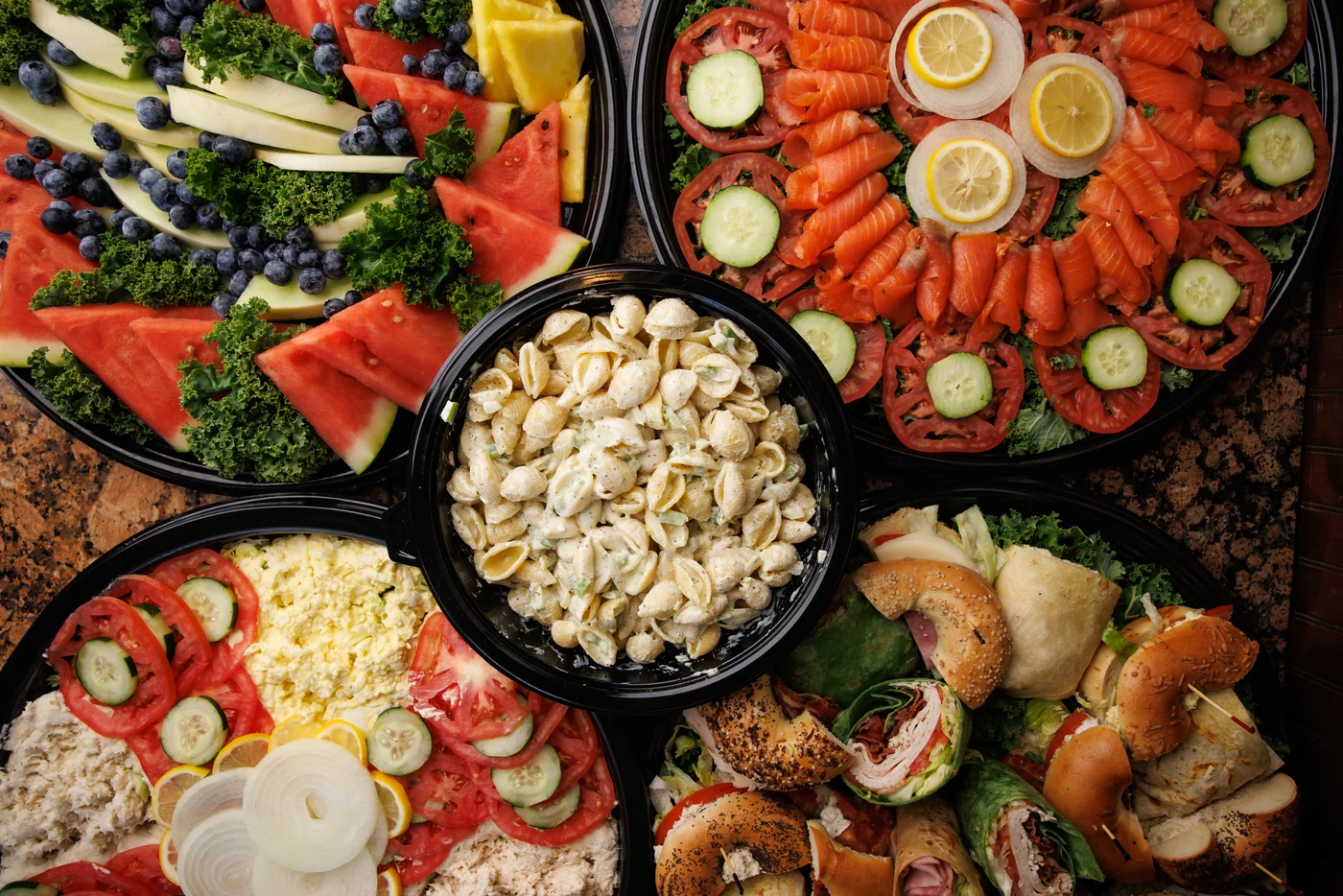 Bagel Boyz catering platters with sandwiches, nova, fruit and deli salads