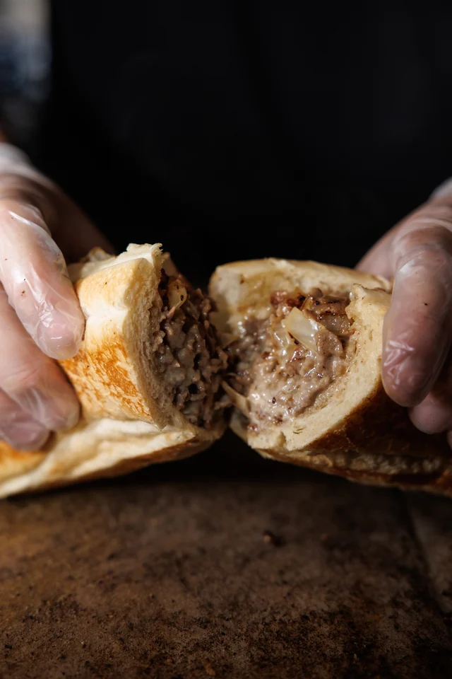 Bagel Boyz cheesesteak with melted cheese and onions