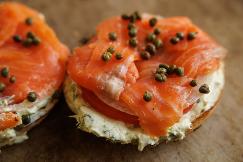 Nova salmon bagel with tomato, red onion, and capers